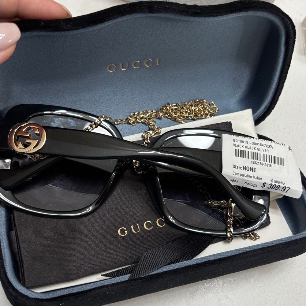 Gucci Elegant Black Sunglasses for Women with velvet case.